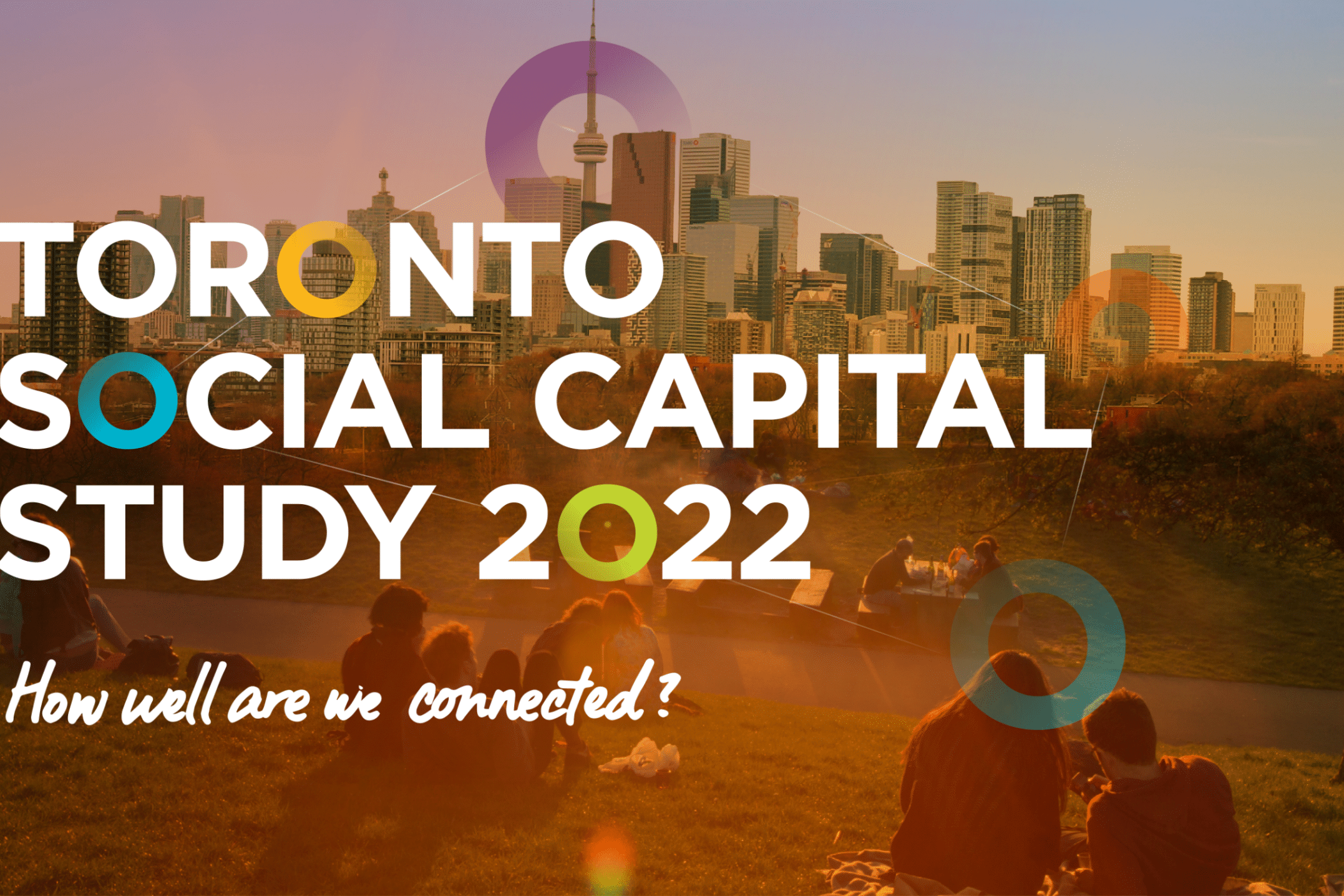 People sit on grass in a park overlooking the Toronto skyline at sunset. Large white text reads “Toronto Social Capital Study 2022” with colorful circles, highlighting the city’s connections and asking, “How well are we connected?”.