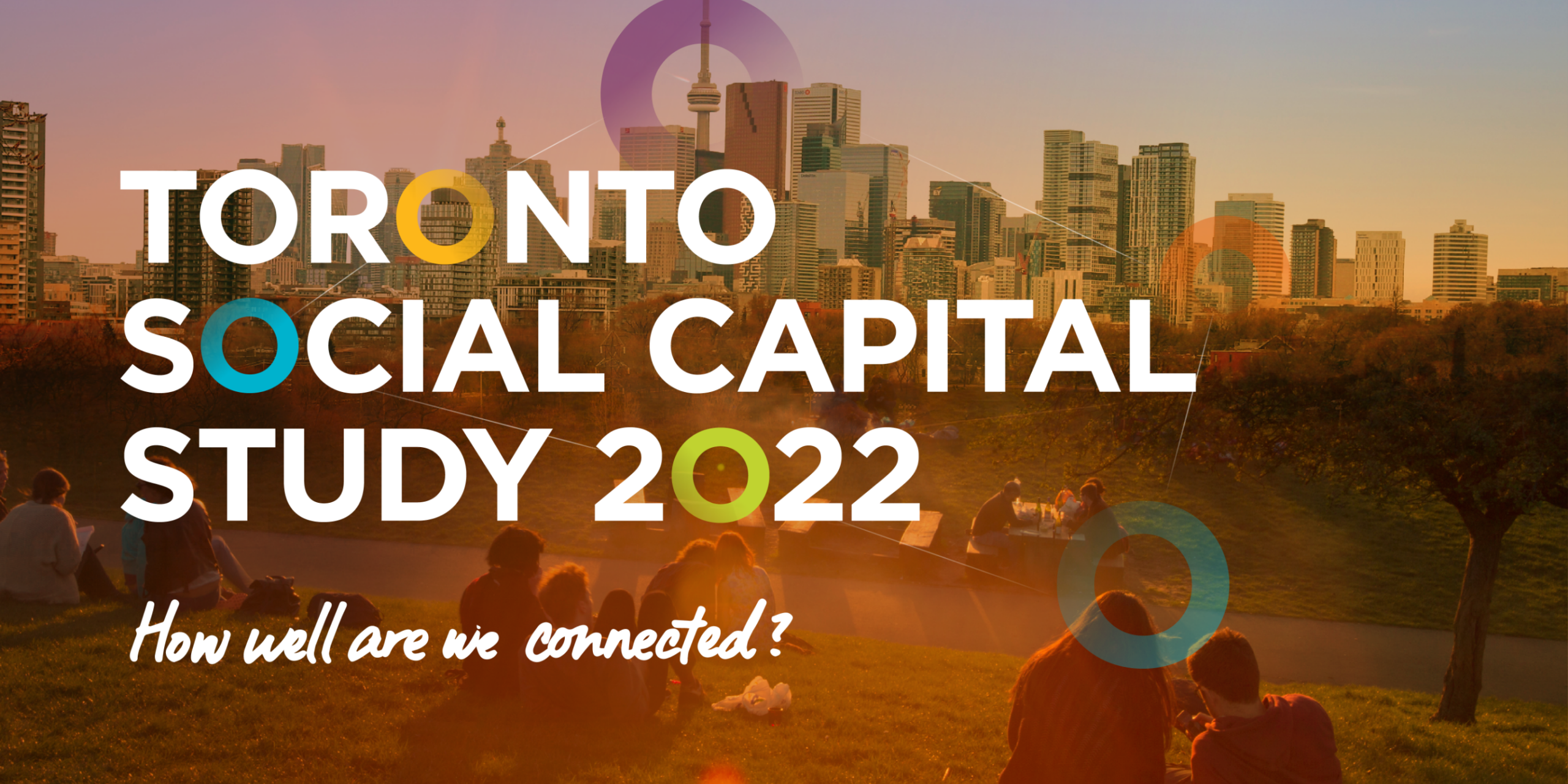 People sit on grass in a park overlooking the Toronto skyline at sunset. Large white text reads “Toronto Social Capital Study 2022” with colorful circles, highlighting the city’s connections and asking, “How well are we connected?”.