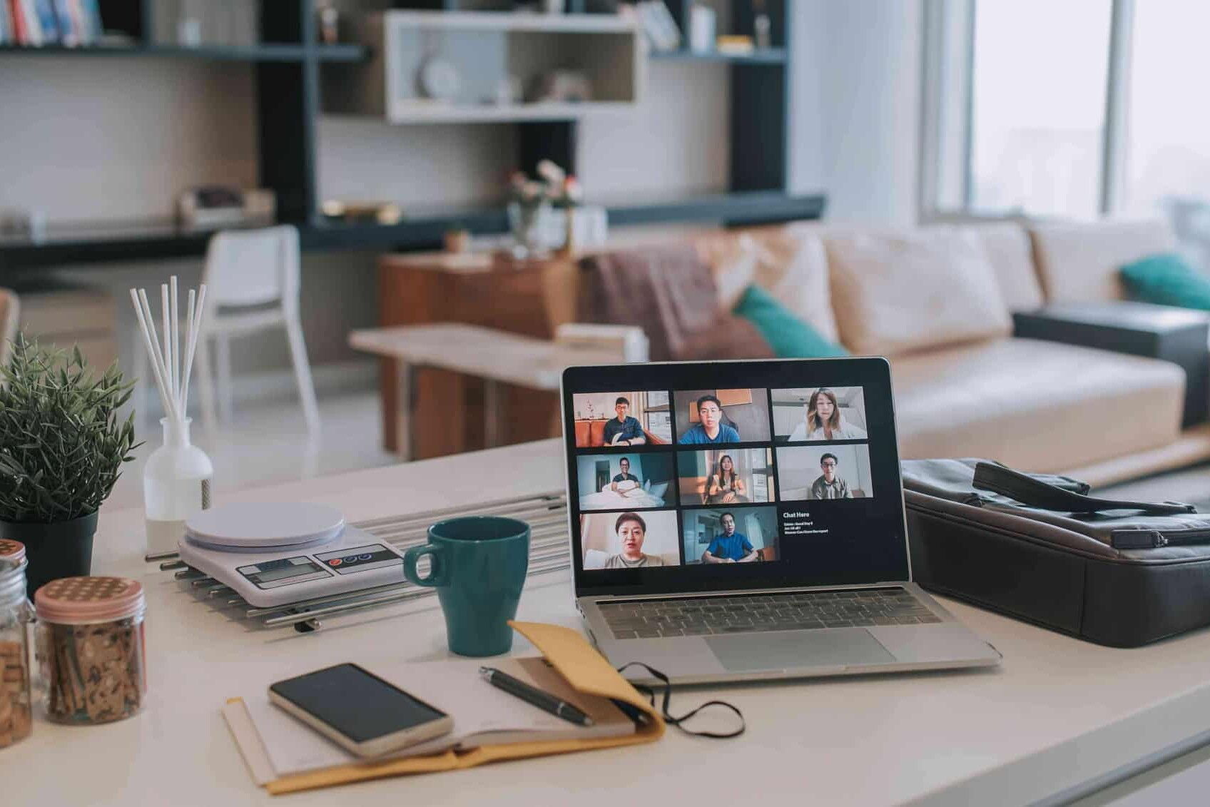A laptop on a table, ready for working from home.